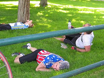 Riders laying on the grass